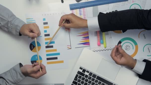 Above view of two businessmen working together at the desk discussing budget, financial charts. Handshake. Shaking hands. — Stock Video