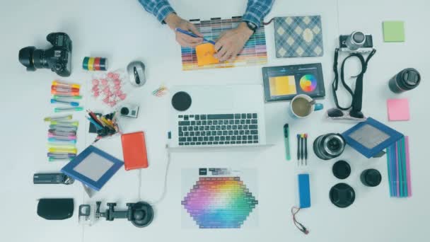 Unrecognizable creative designer working in a creative agency. Top view. — Stock Video