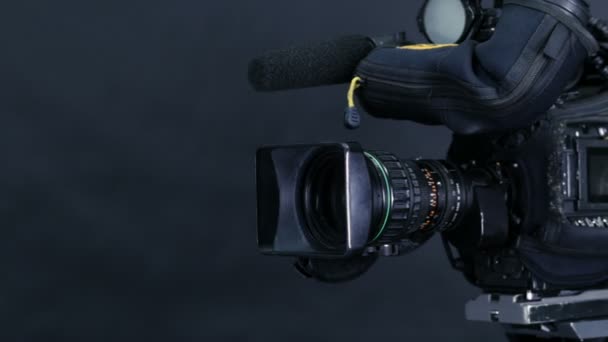 Movement along professional studio camera, camcoder standing in TV studio ready for broadcasting. — Stock Video