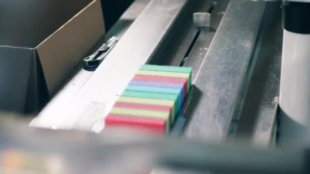 Conveyor is relocating kitchen sponges in batches — Stock Video
