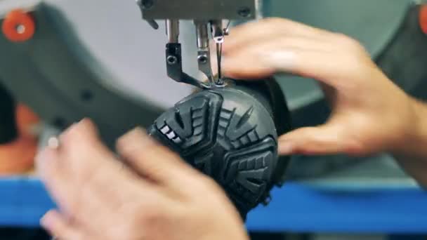 Close up of a boot getting stitched mechanically — Stock Video