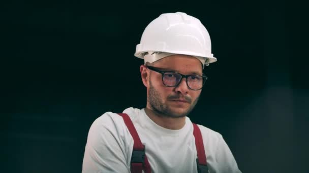 Engineer keeping an eye on metal working process — Stock Video