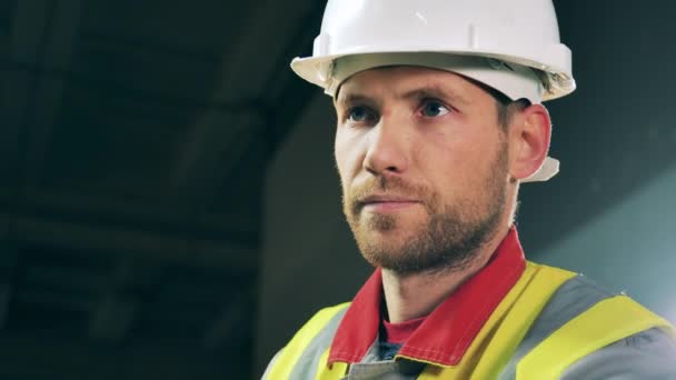 Closeup of worker keeping track of production process — Stock Video