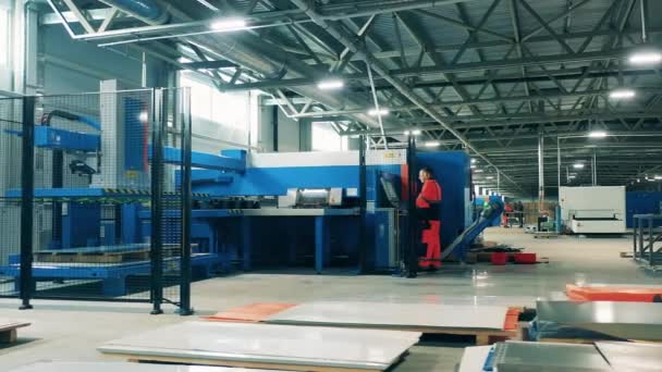 Refrigeration factory unit with an industrial cutting machine. Factory interior. — Stock Video