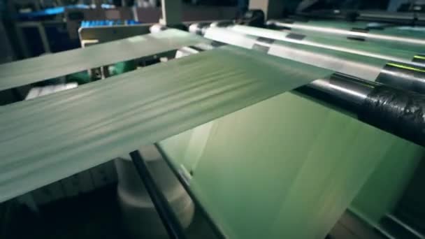 Plastic bag manufacturing machine in action — Vídeo de Stock