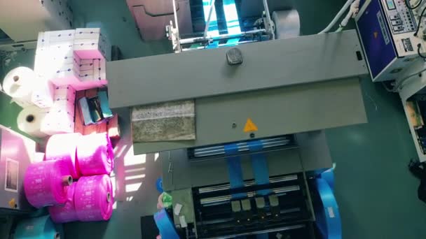 Blue plastic bag manufacturing machine at a polyethylene production factory — Stok Video