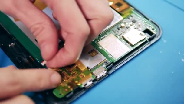 A detail is getting inserted into a cellphone from inside — Stock Video