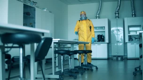 Disinfector is sanitizing quantorium facility — Stock Video