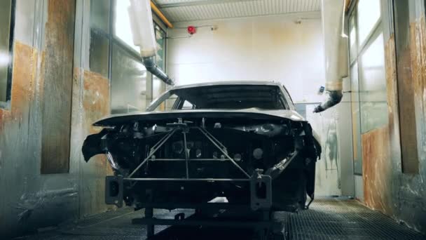 Automotive carcass is getting sprayed with zinc solution — Stock Video