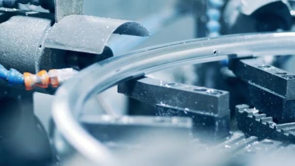 Factory mechanism is drilling a metal wheel rim — Stock Video
