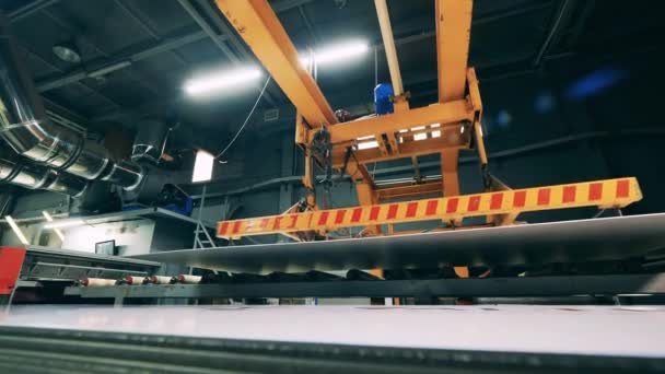 Industrial press is transporting a large metal plate — Video