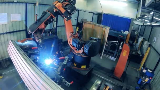Bike metal frame is getting welded by an automated machine — Stock Video