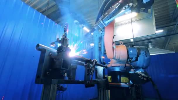 Metal carcass is getting welded by an automated machine — Stock Video