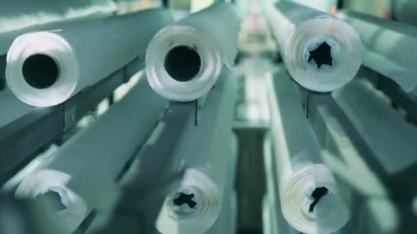 Close up view of white paper rolls moving vertically — Stock Video