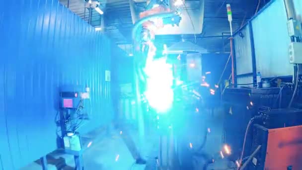 Robotic arm welding a bike frame at a bicycle plant — Stock Video