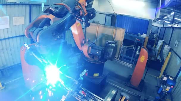 Automated robotic arm welding a rear part of a bike frame — Stock Video