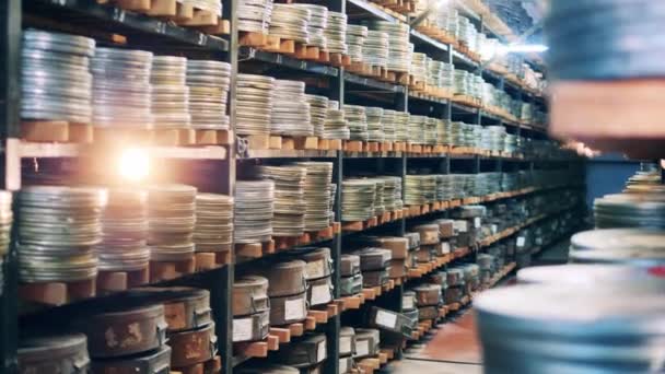 Vintage film archive with packaged tapes. Vintage movie, old cinema concept. — Stock Video