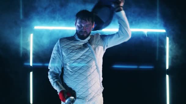 Exhausted fencer takes off his mask after training — Stockvideo