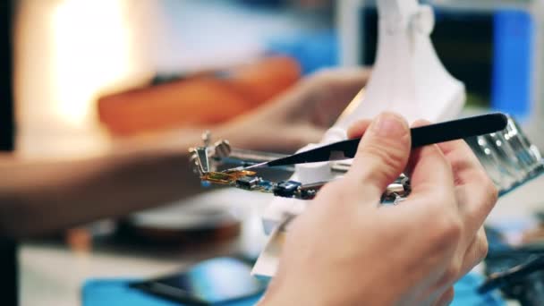 Close up of microcircuits getting warmed up before soldering — Stock Video