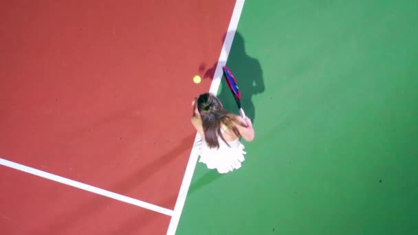 Top view of a woman playing tennis on the court — Stock Video