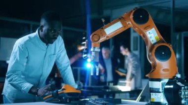 African science worker is digitally operating a robot