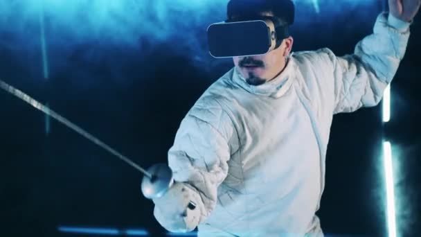 Male fencer is having a virtual training session. Virtual reality, augmented reality game concept. — Stock Video