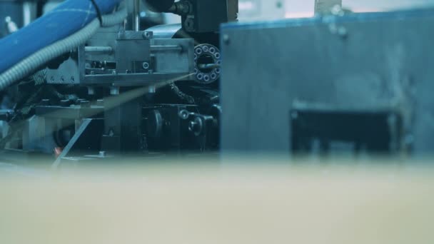 Close up shot of thin white cable winding to a spool — Stock Video