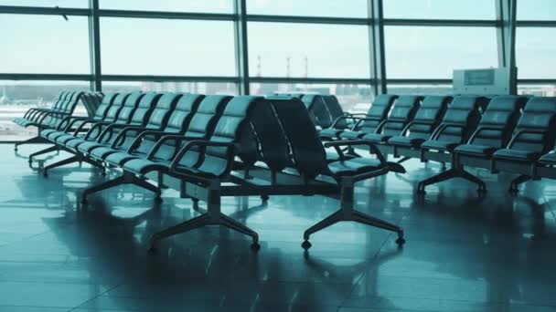 Airport lounge with seats marked for social distancing — Stock Video