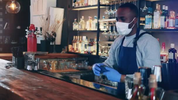 Male barista gives a cup of coffee after contactless payment — Stock Video