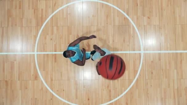 African-american opponents are playing basketball in a top view — Stock Video