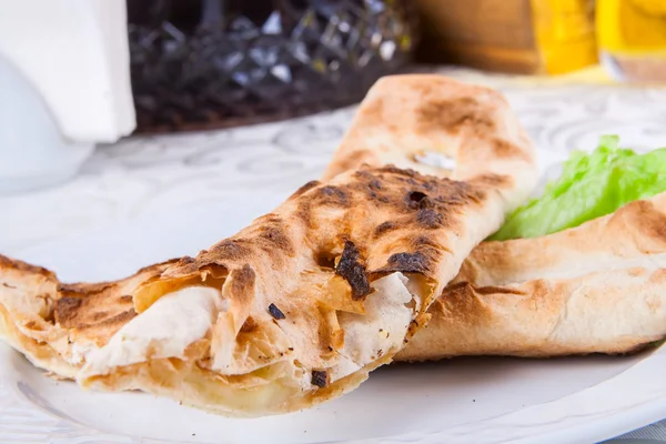 Roasted rolls of bread lavash filled with cheese