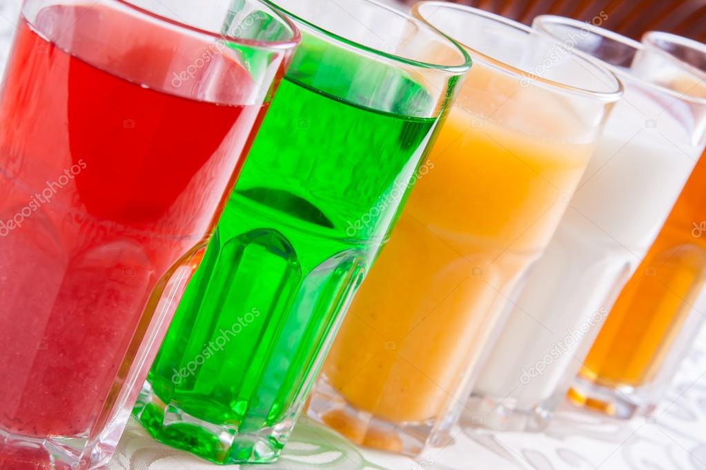 Different soft drinks in a glass
