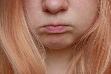 Close-up portrait of a girl with orange hair without makeup and skin retouching. clipart
