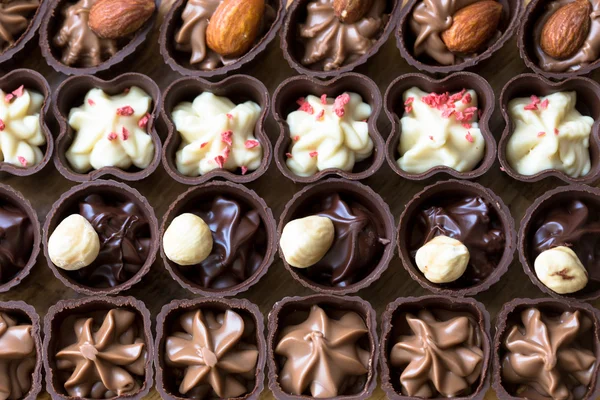 Los bombones distintos en el fondo - la comida dulce . —  Fotos de Stock