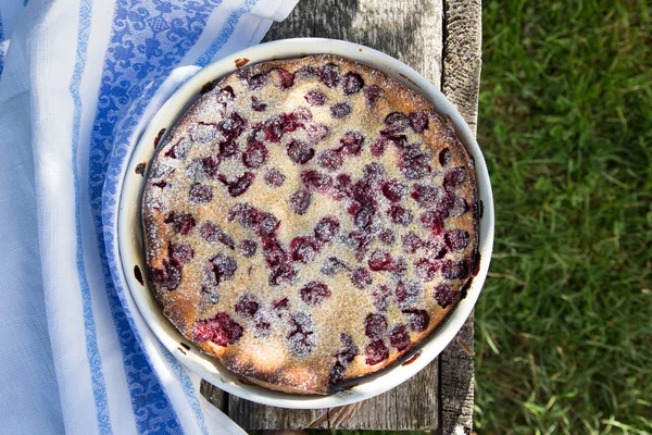 Cherry clafoutis. Homemade cherry pie on rustic background