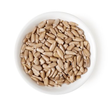 Bowl of sunflower seeds isolated on white, top view clipart