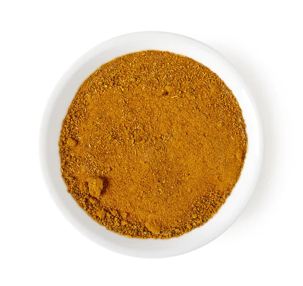 Ciotola di polvere di curry isolata su bianco, vista dall'alto — Foto Stock