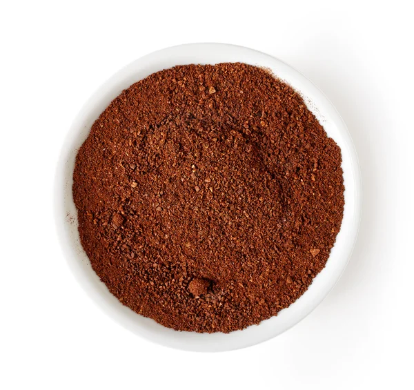 Ciotola di caffè in polvere isolata su bianco, dall'alto — Foto Stock