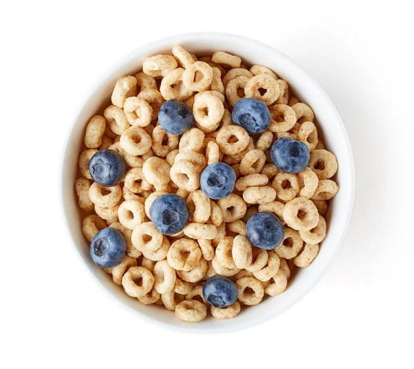 Bowl of whole grain cheerios cereal with blueberries isolated on — Stock Photo, Image