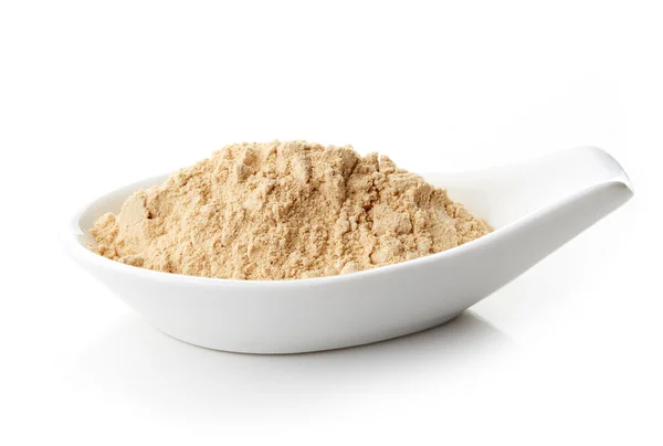 Maca en polvo en cuchara de porcelana blanca — Foto de Stock