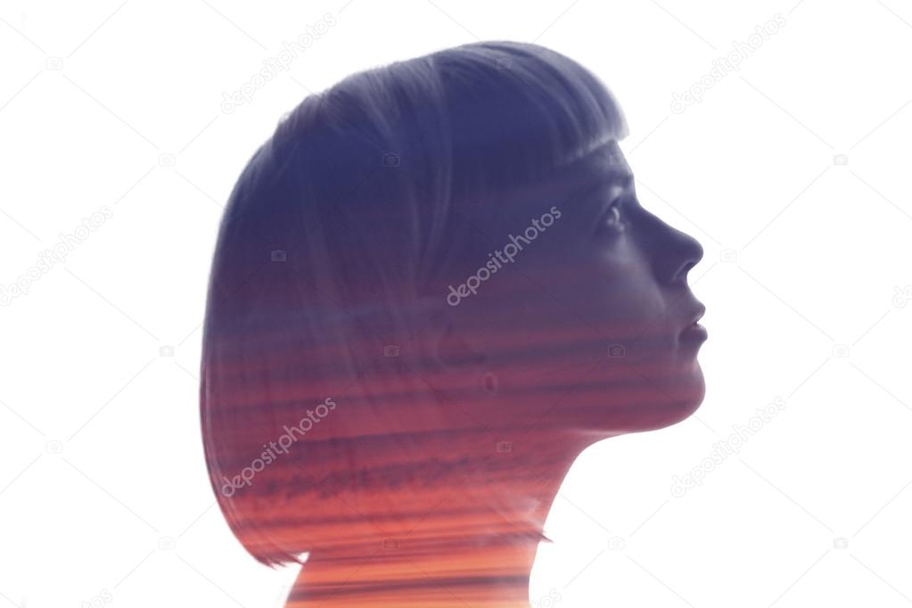 Girl profile with double exposure sunset