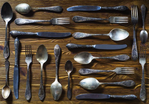 Stock image Old used cutlery on rustic wooden background