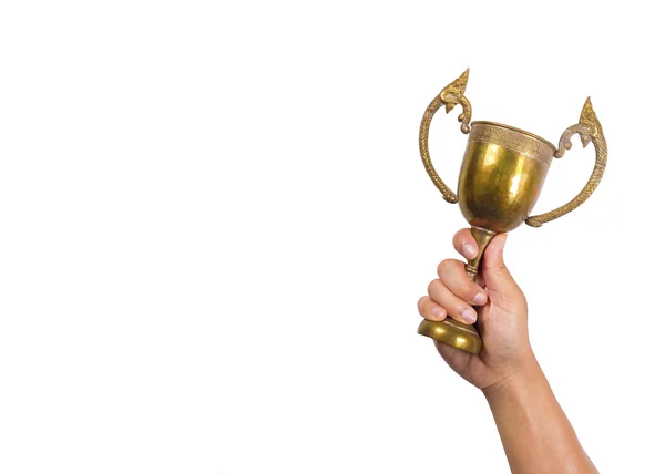 Segurando a taça com fundo branco.Conceptual de ganhar . — Fotografia de Stock