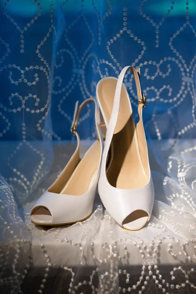 Wedding shoes on a blue and white background Royalty Free Stock Photos