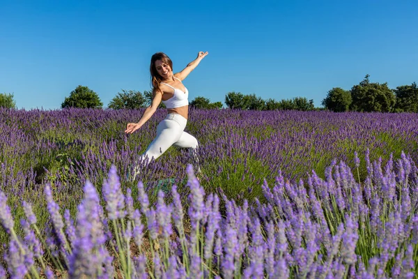 Warrior Yoga Pose Blooming Lavender Field Woman Long Brown Hair Stock Image