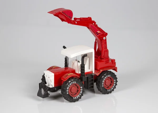 Tractor de juguete sobre fondo blanco — Foto de Stock