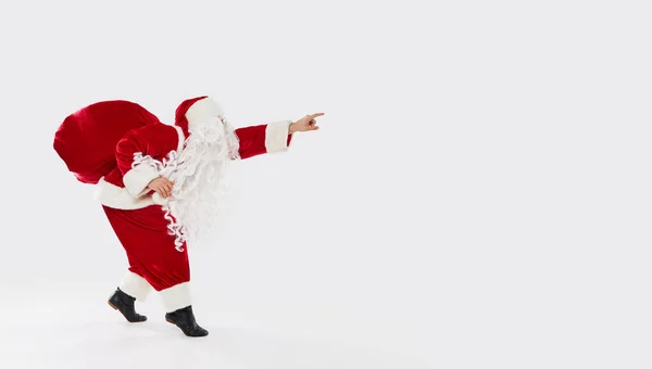 Joyful Santa Walks Widely Bag Gifts His Back White Background — Stock Photo, Image