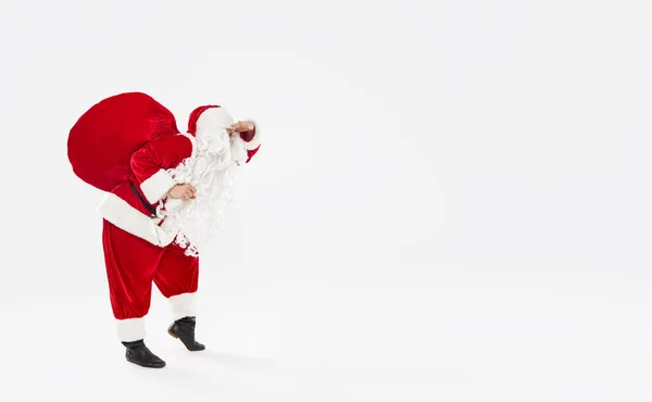 Joyful Santa Walks Widely Bag Gifts His Back White Background — Stock Photo, Image