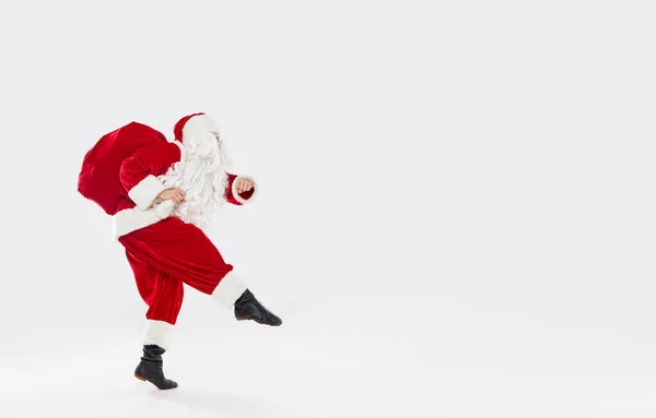 Joyful Santa Walks Widely Bag Gifts His Back White Background — Stock Photo, Image