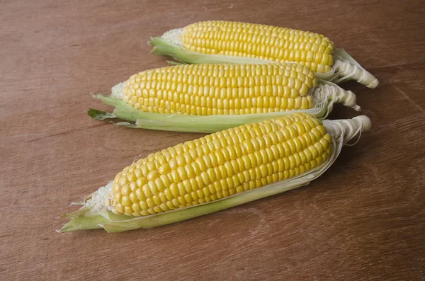 Corn on wood brackground — Stock Photo, Image